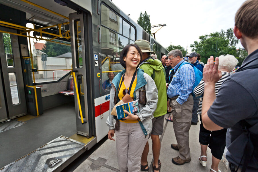 A woman boarding a train.