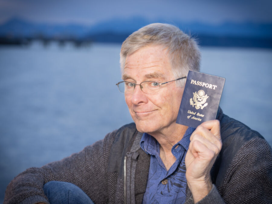 Rick Steves holding a passport