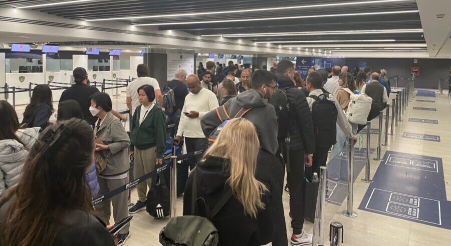 People waiting in line at the airport.