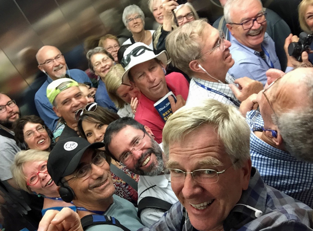 Rick Steves with group in elevator