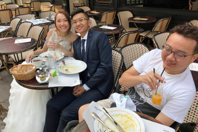 wedding couple and photographer at cafe