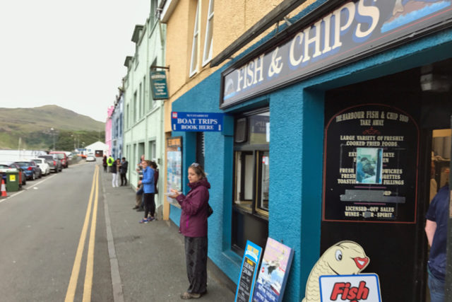 people eating fish and chips
