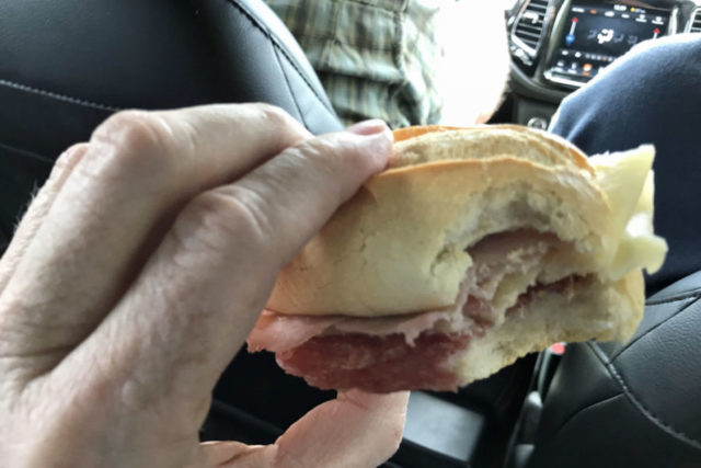 small sandwich made of roll and slice of meat