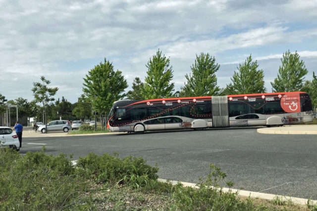 large coach bus in a parking lot