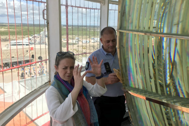 tour guide using hand gestures to describe mechanics inside lighthouse