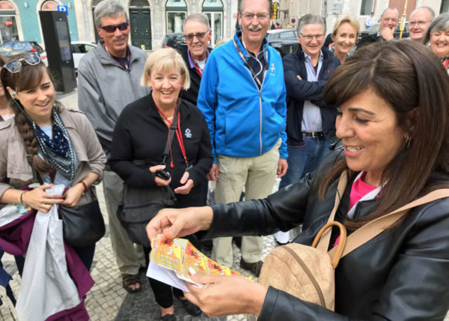 Fatima Bugarin handing out lottery tickets to group