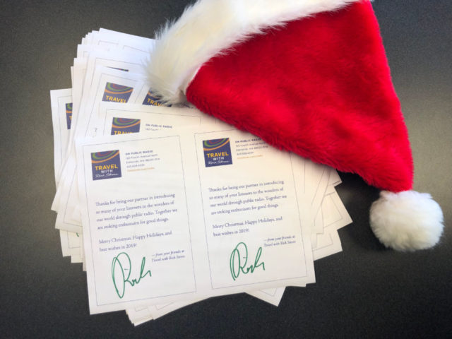 signed letters from Rick Steves and a santa hat